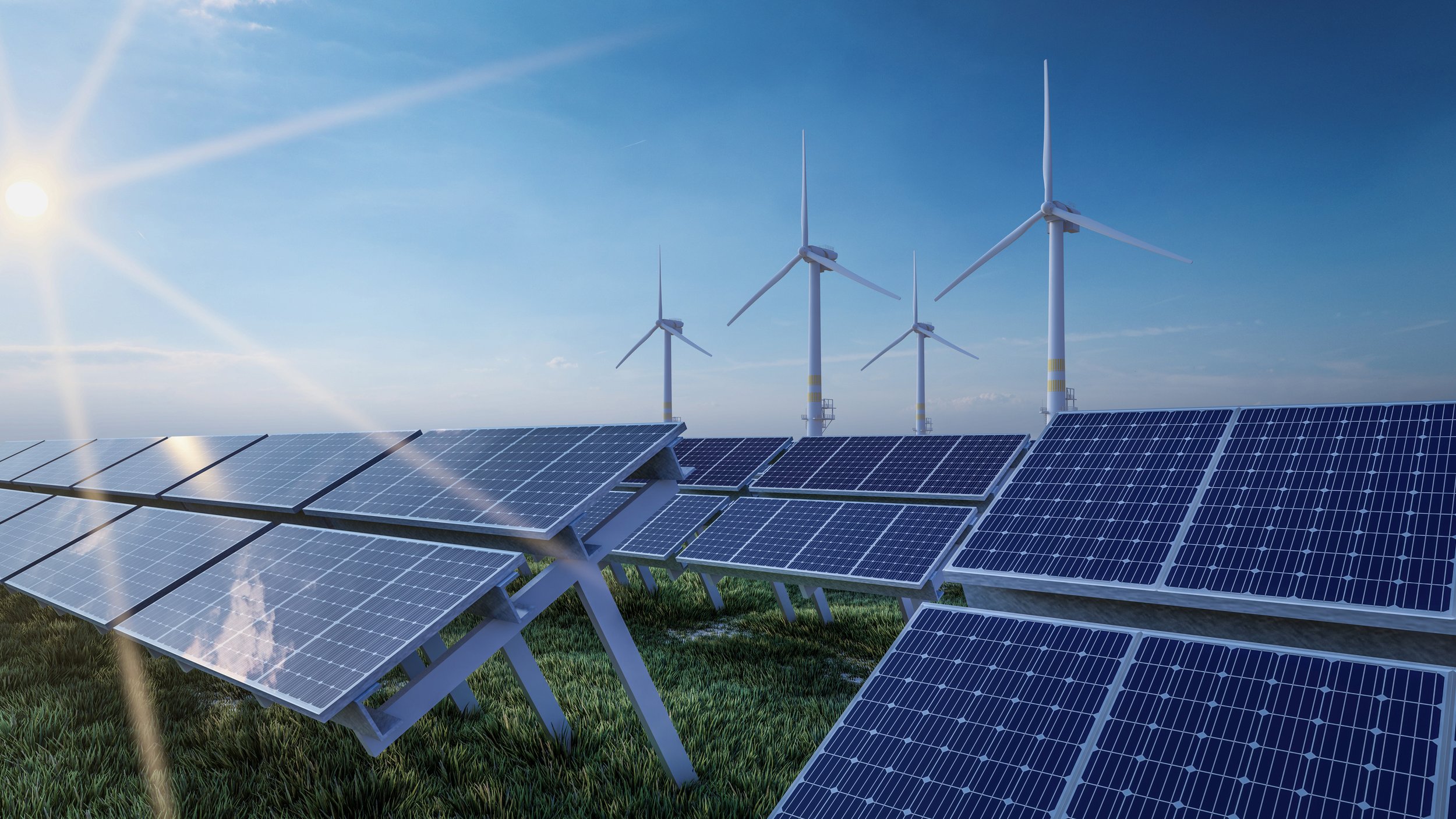 Turbinas eólicas y paneles solares que generan energía limpia